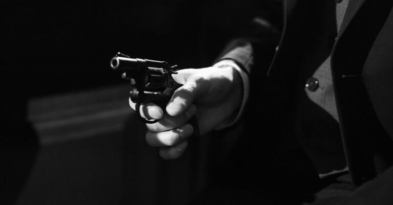 Threats - Photo of Person Holding a Handgun