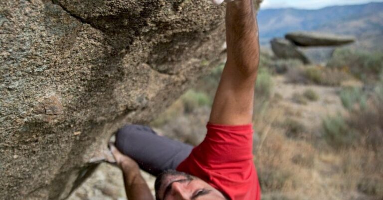 Efforts - Man Climbing on Gray Concrete Peak at Daytime