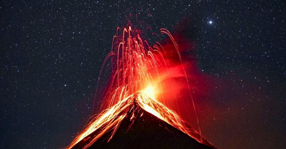 Eruptions - Volcano Erupting at Night Under Starry Sky